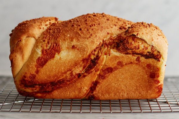 a loaf of bread sitting on top of a cooling rack