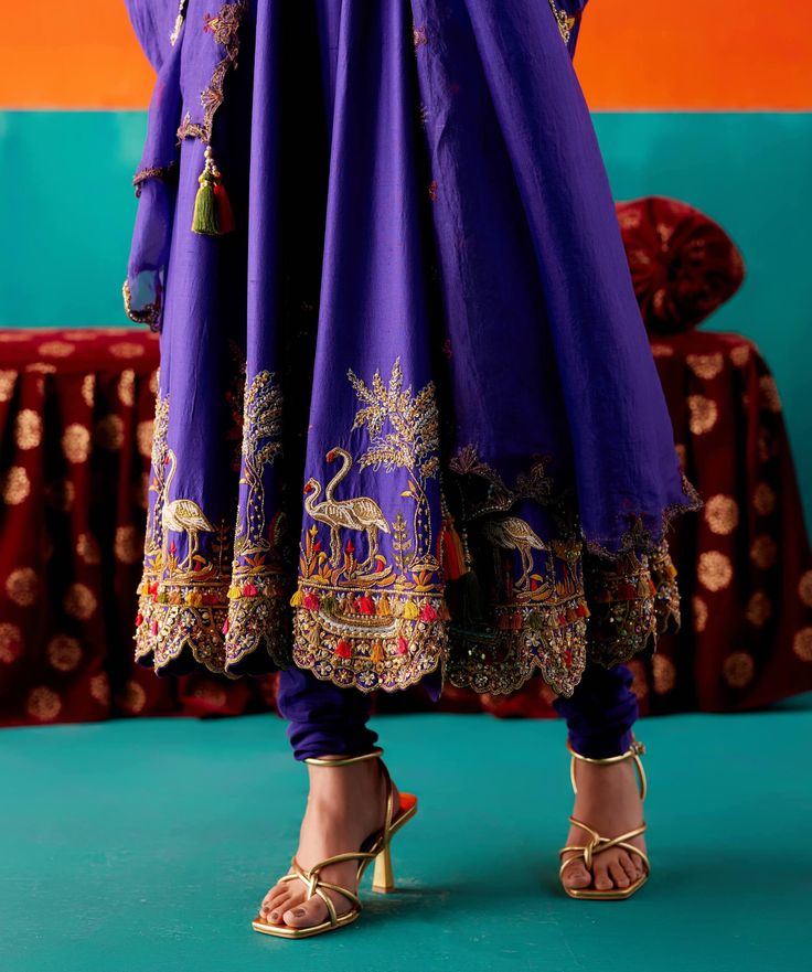 Dress in timeless grace with this purple anarkali set, featuring flora and fauna embroidery adorned with various embellishments for added allure. Paired seamlessly with complementing pants and an embroidered dupatta, this ensemble exudes sophistication and intricate detailing. Anarkali Kurti Design, Purple Anarkali, Lehenga Saree Design, Choli Dress, Indian Outfits Lehenga, Embroidered Anarkali, Designer Kurti Patterns, Kurti Embroidery Design, Casual Indian Fashion