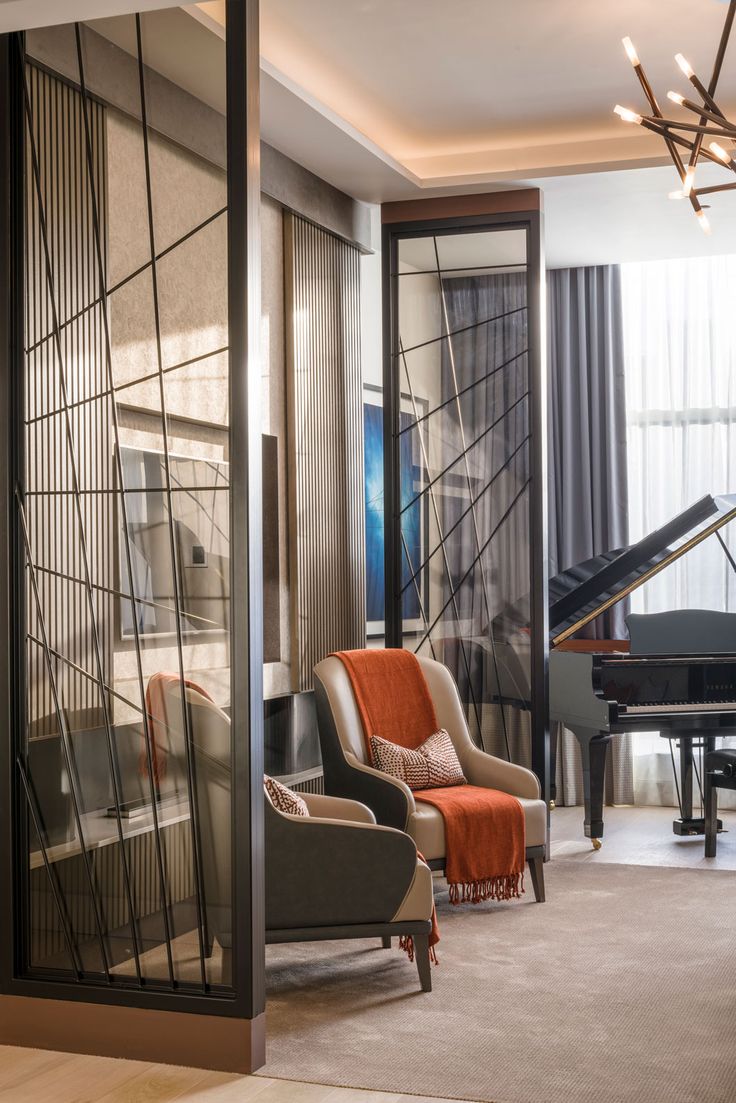 a living room filled with furniture and a piano