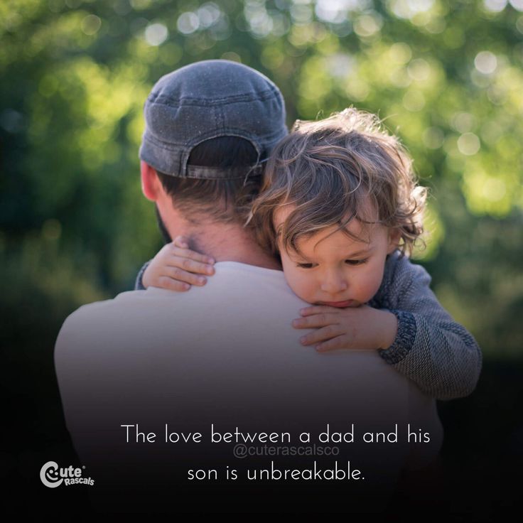 a man holding a little boy in his arms with the caption, the love between a dad and his son is unbreakable