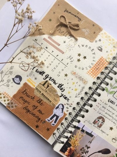 an open planner book with stickers on it