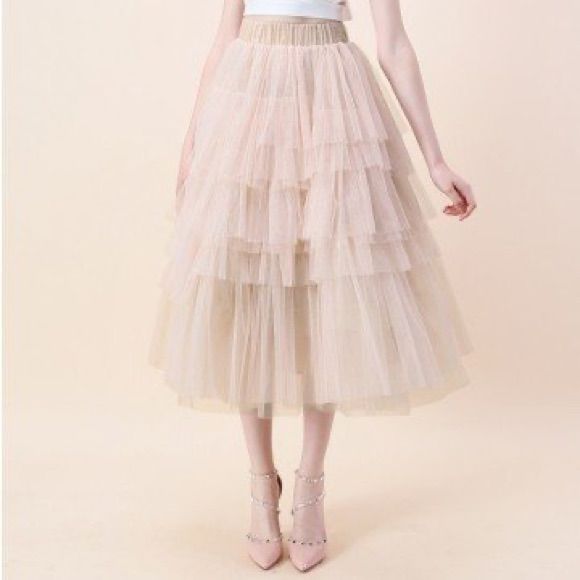 New With Tags. Chicwish Love Me More Tulle Skirt M/L. Color: Nude Pink Size: Xs/S Details: - Tiered Mesh Fabric Finished - Multi Mesh Layer - Elastic Waistband - Lined - 100% Polyester Please Feel Free To Ask Any Questions. Price Is Firm! Feminine Beige Tiered Skirt, Spring Tulle Pleated Skirt, Feminine Ruffled Midi Skirt Bottoms, Feminine Midi Skirt For Party, Feminine Beige Party Bottoms, Beige Party Skirt For Spring, Spring Tulle Midi Skirt, Spring Midi Tulle Petticoat, Party Beige Midi Skirt