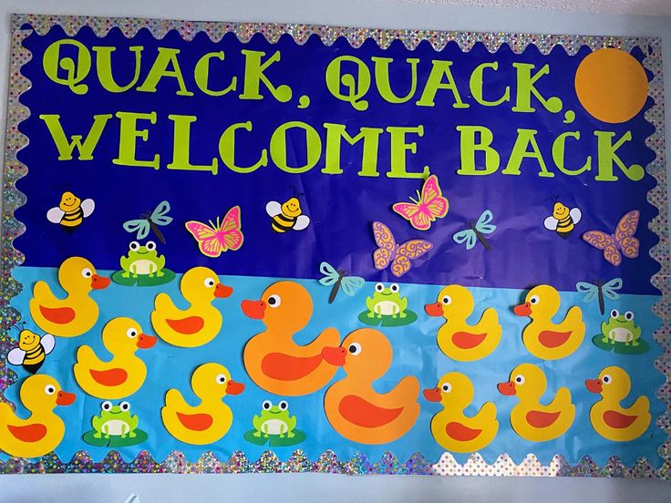 a welcome sign with rubber ducks and butterflies on the front for children's school