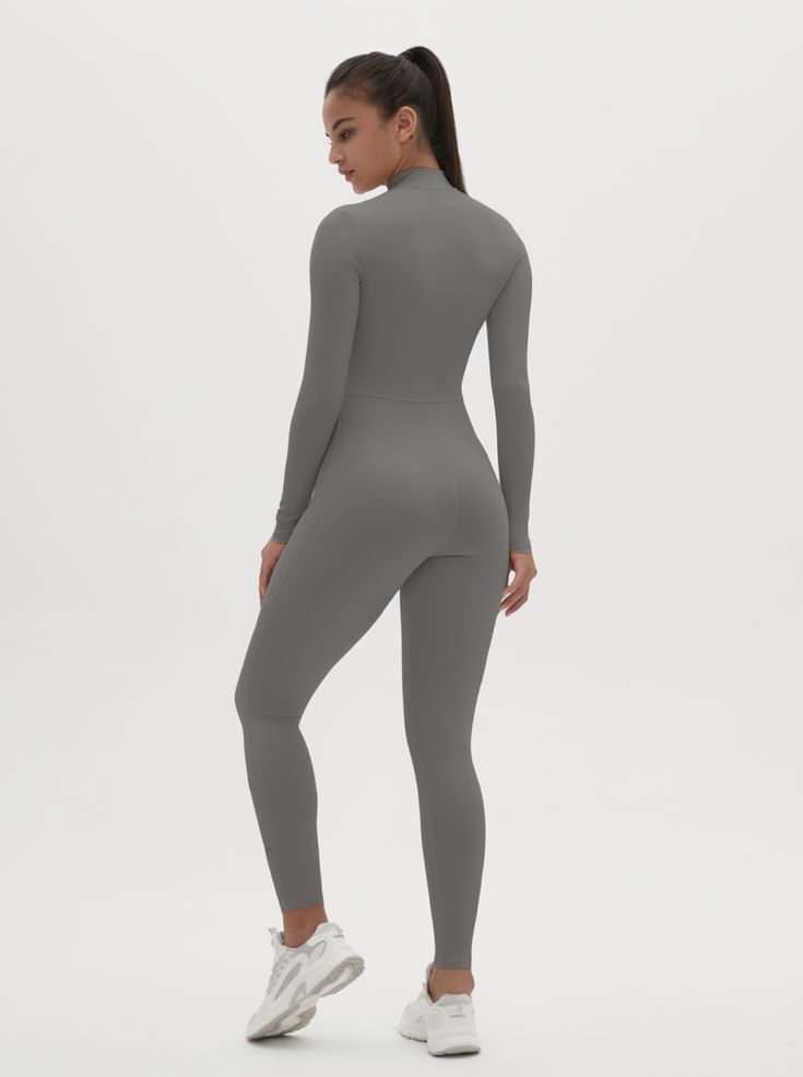 Why We Love It: The Hannah Long Sleeve Zipper Bodysuit is the epitome of sleek, modern activewear. This bodysuit combines functionality with a streamlined design, ensuring you look and feel your best whether you're at the gym or out and about. Fit and Features: Front Zipper Detail: The front zipper allows for easy wear and adjustability, adding a chic element to this versatile piece. Long Sleeves with Thumbholes: Provides added coverage and a secure fit, perfect for cooler weather or intense workouts. Buttery Soft Fabric: This bodysuit feels like a second skin, offering unmatched comfort and flexibility. High Performance: The four-way stretch material ensures maximum freedom of movement, making it ideal for any activity. Moisture-Wicking Technology: Keeps you dry and comfortable, no matter Fitted Sporty Bodysuit For Loungewear, Sporty Fitted Bodysuit For Loungewear, Sleek Fitted Full Length Activewear, Second-skin Bodysuit For Loungewear In Athleisure Style, Second-skin Athleisure Bodysuit For Loungewear, Functional Second-skin Activewear For Gym, Second-skin Functional Activewear For Gym, Sporty Second-skin Bodysuit For Loungewear, Sporty High Stretch Bodysuit For Loungewear