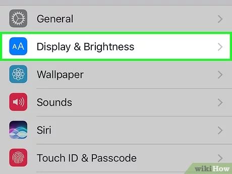 the settings on an iphone's display and brightness screen with icons in different colors