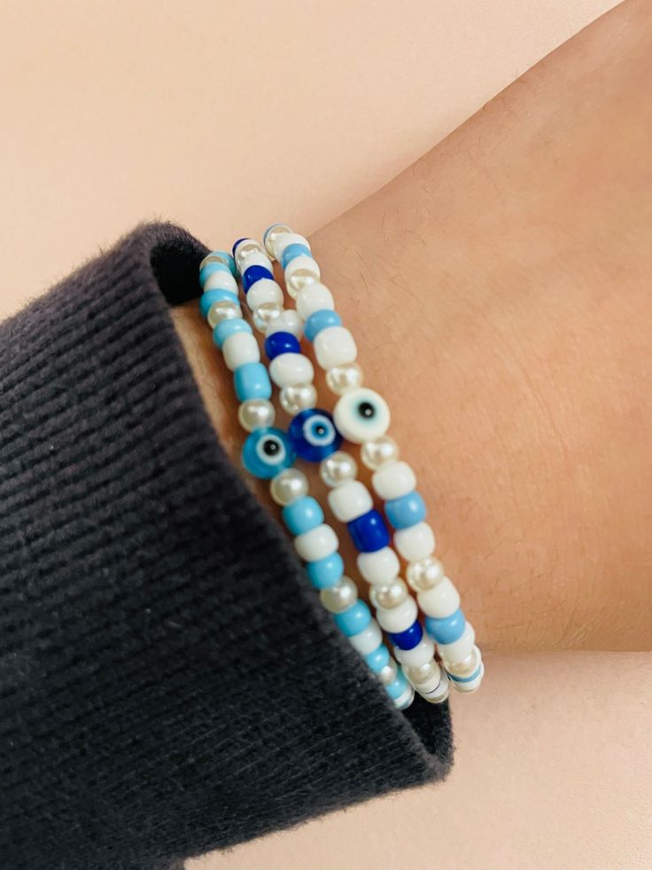 E-bead glass bracelets; evil eye; handmade🧿 Evil Eye Bead Bracelet Gift, Handmade Blue Evil Eye Bracelet With Round Beads, Spiritual Evil Eye Beaded Bracelets For Beach, Trendy Handmade Evil Eye Bracelet With Round Beads, Blue Evil Eye Friendship Bracelets With Round Beads, White Evil Eye Beaded Bracelets, Bohemian Beaded Bracelets With Evil Eye, Bohemian Evil Eye Bracelet With Round Letter Beads, Handmade Blue Evil Eye Bracelet