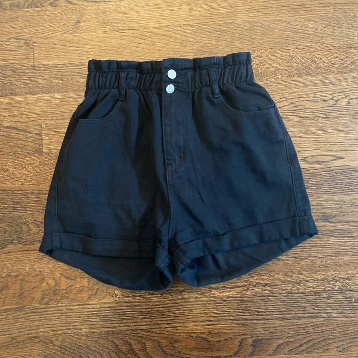 Black High Waisted Shorts. Elastic Band At The Waist To Give A Paper Bag Look. Super Cute And Never Worn. Black High-waisted Shorts With Elastic Waistband, Black High-waist Shorts With Pockets, Black Shorts With Elastic Waistband For Day Out, Black High Rise Bottoms With Elastic Waistband, Black High-waisted Cotton Shorts, Black Bottoms With Pockets For Day Out, Black Cotton High-waisted Shorts, Chic Black Cotton Shorts, Black Short Bottoms For Day Out