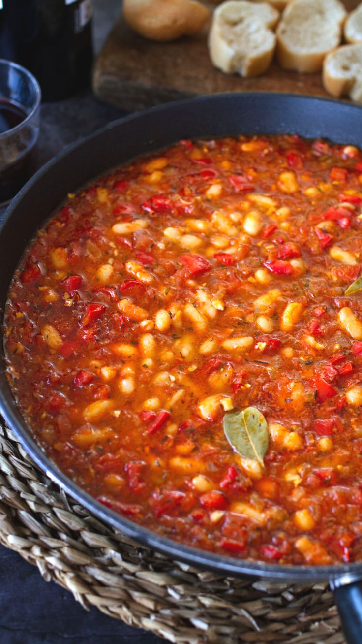 A pan with cooked white bean stew in it with a bay leaf visible on top Mexican Bean Stew, Bean Stew Vegan, High Fiber High Protein, Food Preps, Mexican Appetizer, Cannellini Beans Recipes, High Protein High Fiber, Mexican Food Recipes Appetizers, Stew Vegan