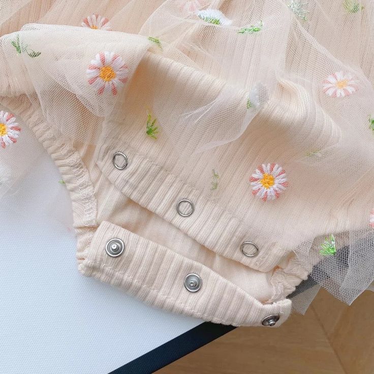 Dress your little princess in sweet style with our Long Sleeve Daisy Tutu Romper, a charming ensemble perfect for any occasion! This adorable romper features long sleeves to keep her warm and cozy, while the delicate daisy print adds a touch of whimsy and charm. The tutu skirt adds a playful flair, perfect for twirling and dancing. The snap closures make dressing and diaper changes a breeze, while the stretchy waistband ensures a comfortable fit. Material: Cotton. Color: Beige. Tutu Cakes, Baby Tutu Dress, Baby Tutu Dresses, Half Birthday, Baby Tutu, Birthday Special, Baby Christmas Gifts, Easter Outfit