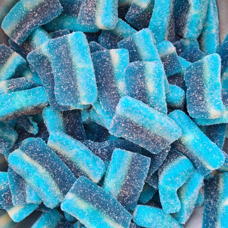 blue and white candies are in a bowl