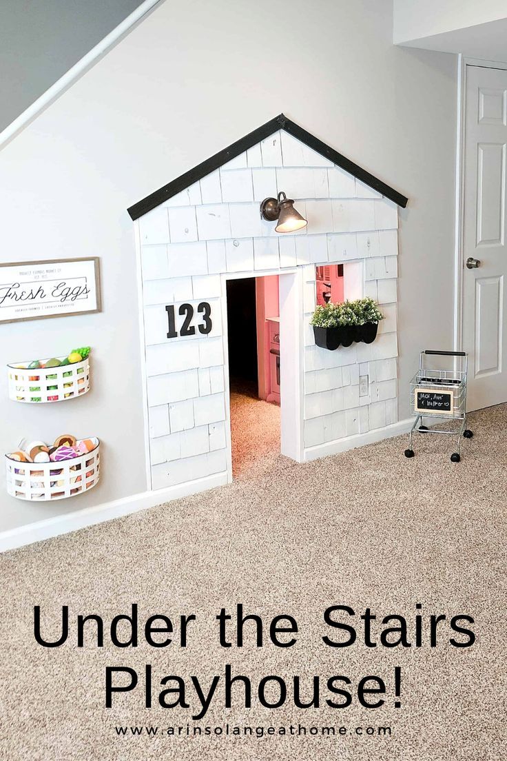 a play house with the words create an under stairs playhouse