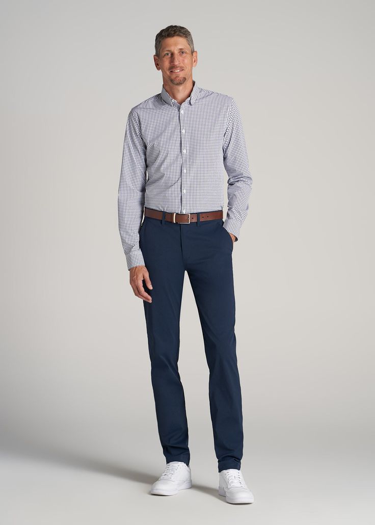 About Our Men's Tall Pants These extra-long chinos strike the perfect balance between classic and comfortable. They're designed to look like a pair of tapered chinos but are made of a lighter stretchy fabric that provides plenty of room for movement so you can tee off on the golf course, take the dog for a walk or grab dinner with friends at that new restaurant in town. We know how hard it is to find men's tall pants, which is why we made sure this pair had an extra-long inseam measured specific Slim Fit Straight Chinos For Business Casual, Business Casual Tapered Leg Chinos With Welt Pockets, Slim Fit Tapered Leg Chinos For Business Casual, Tailored Business Chinos, Slim Fit Chinos For Business Casual, Business Casual Chino Dress Pants, Business Casual Chinos With Welt Pockets, Tailored Chinos For Business Casual, Business Slim Fit Chinos