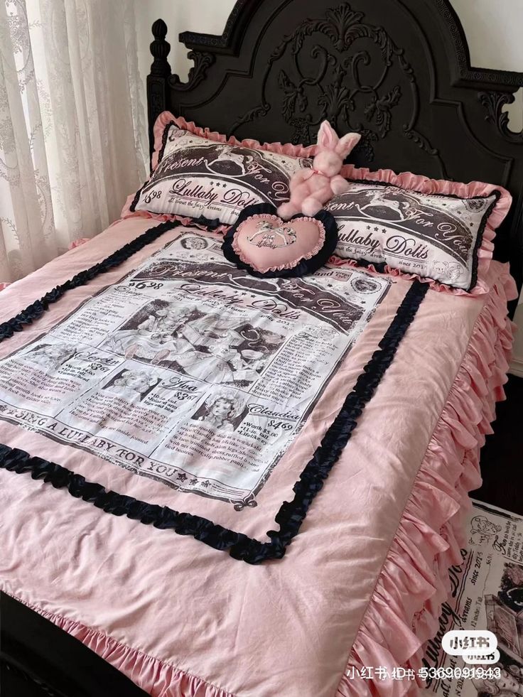 a bed with pink and black ruffled bedspread, pillows and pillow cases