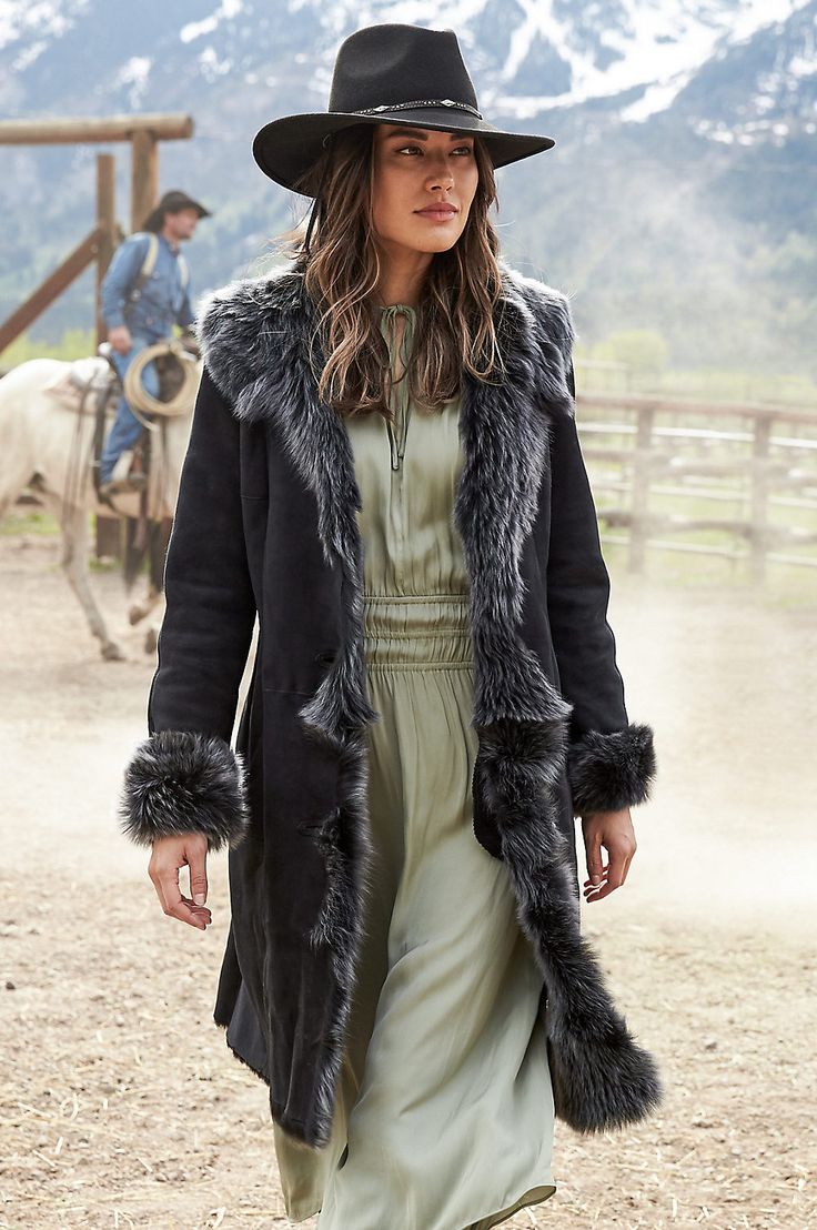 The Sandra is crafted from delightfully soft, warm Spanish Merino lamb shearling and features lush, unshorn Toscana trim at the draped collar, cascading tuxedo front, and roll-back cuffs. With a chic, asymmetrical four-button front closure, flattering fit-and-flare cut, and two slash pockets. Be prepared to turn heads! Burberry Raincoat, Shearling Coat Womens, Look Boho Chic, Perfect Coat, Sheepskin Coat, Rugged Style, Rare Breed, Shearling Coat, Fur Fashion