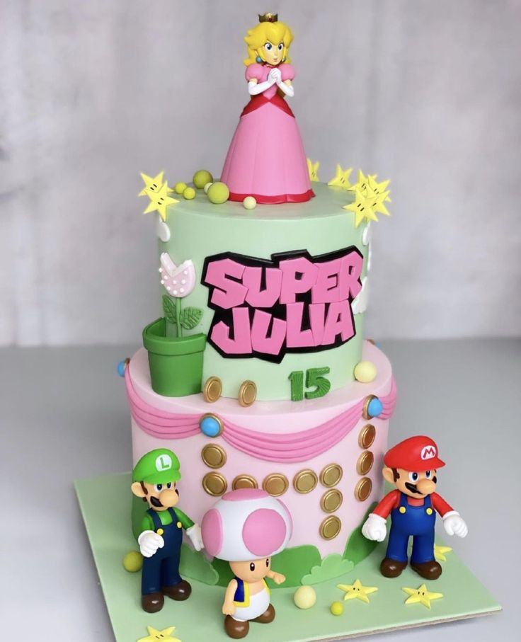 a birthday cake with mario and princess peach on the top is made out of fondant