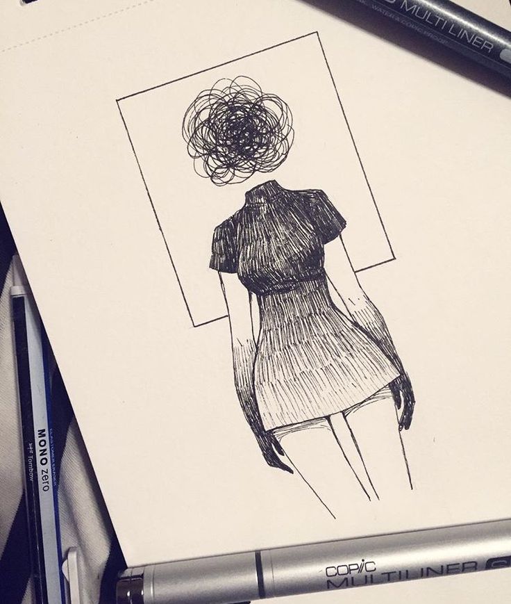 a drawing of a woman's dress with a flower in her hair on a piece of paper