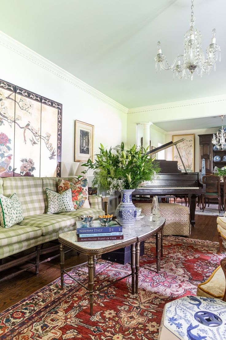 a living room filled with furniture and a piano