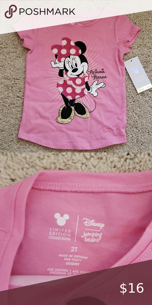 a pink shirt with minnie mouse on the front and back, next to an ipod