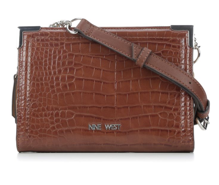 Introducing the Nine West Radzi Wallet on a String – a stylish and versatile accessory that combines the functionality of a wallet with the convenience of a crossbody bag. This compact yet spacious wallet is designed to keep your essentials organized while adding a touch of sophistication to your ensemble. Adjustable shoulder strap, Padded synthetic construction, Large main compartment with zipper closure | Nine West Radzi Wallet on a String in Mahogany Brown Wallet On Chain With Removable Pouch, Daily Use Brown Rectangular Wallet On Chain, Brown Rectangular Wallet On Chain With Removable Pouch, Brown Crossbody Wallet On Chain For Daily Use, Brown Crossbody Wallet On Chain, Shoe Carnival, Unisex Accessories, Shoe Store, Handbag Accessories