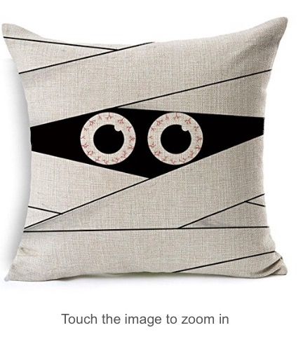 a pillow with two circles on it and the words touch the image to zoom in