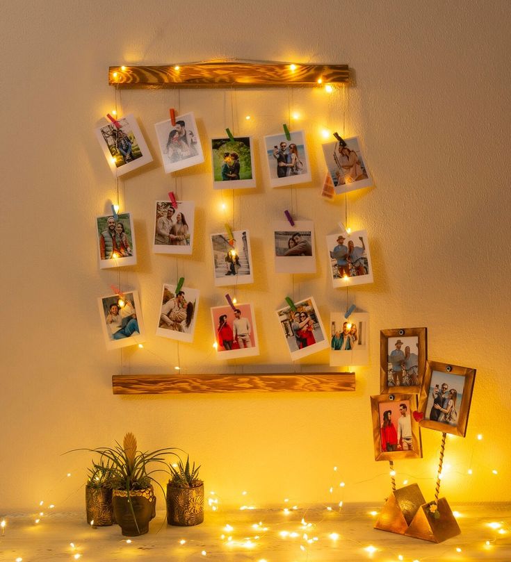 a wall hanging with pictures and lights on it