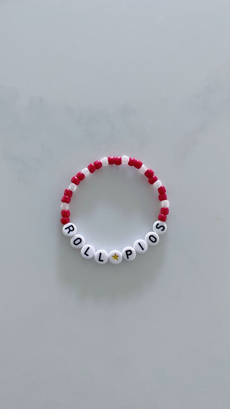 Show your school pride and complete your game day outfit with a custom red and white beaded bracelet for Sacred Heart University! School Spirit Beaded Bracelets With Letter Beads For Gifts, School Spirit Beaded Bracelet With Letter Beads As Gift, School Spirit Jewelry With Letter Beads For Gifts, Red Letter Beads For Friendship, Personalized Red Wristband With Round Beads, Red Beaded Bracelets With Letter Beads For Game Day, White School Spirit Jewelry As A Gift, White School Spirit Jewelry As Gift, School Spirit White Jewelry As Gift