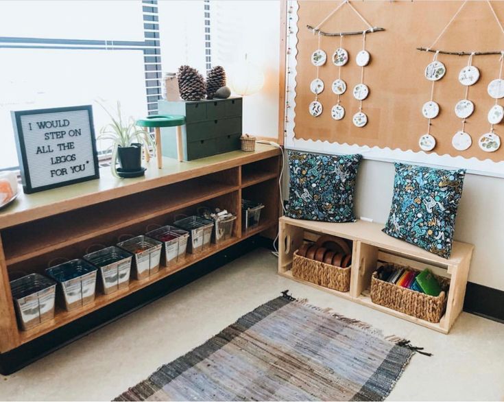 a room filled with lots of crafting supplies and decor on the wall next to a wooden shelf