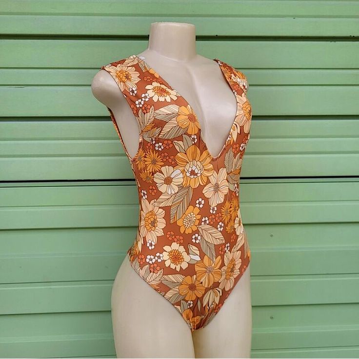 Tags Still Attached, Liner Not Attached, And Never Worn. Zara One Piece Deep-V Swimsuit! Beautiful Warm Orange Colors And Florals. 80% Polyester Summer V-neck Printed Bodysuit, Fitted V-neck Floral Print Bodysuit, Brown Fitted V-neck Swimwear, Fitted Brown V-neck Swimwear, Fitted Orange V-neck Bodysuit, Brown V-neck Swimwear For The Beach, Chic V-neck Swimwear With Floral Print, Brown One-piece Swimwear For Summer, Brown Beachwear Bodysuit For Vacation