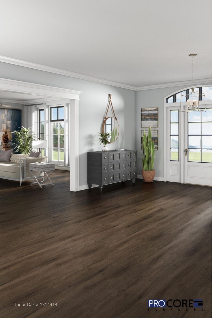 an empty living room with wood floors and white walls