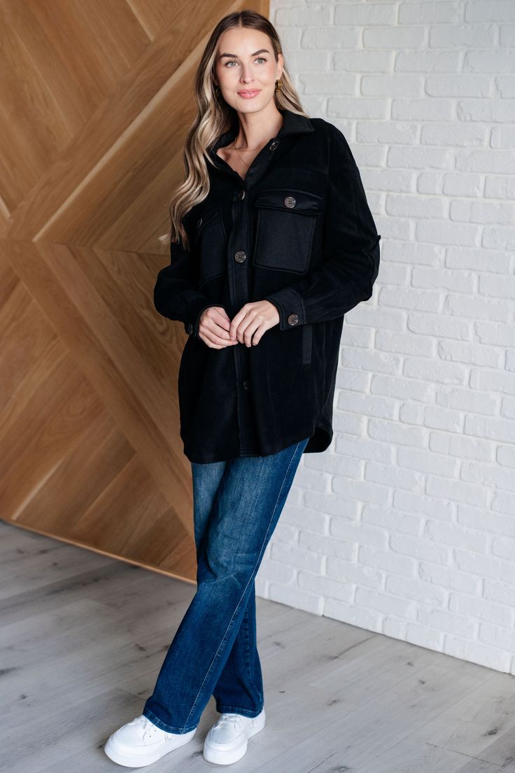 Step up your outerwear game with the Fantastic in Fleece Jacket in Black. Featuring a classic collared neckline, it’s designed with functional button closures for a tailored fit. Contrast panels add a modern twist, while elbow patches lend a touch of rugged charm. Practicality meets style with functional chest patch and side welt pockets, providing ample storage for your essentials. Perfect for layering over any casual outfit, this jacket is a versatile and chic addition to your wardrobe. Knit F Black Fleece Jacket For Winter Layering, Winter Workwear Shacket With Corduroy Collar, Winter Black Shacket With Snap Buttons, Black Long Sleeve Shacket With Button Closure, Black Button-up Outerwear For Cold Weather, Black Outerwear With Lapel Collar And Button Closure, Classic Black Long Sleeve Shacket, Black Button-up Winter Outerwear, Black Fleece Jacket With Pockets For Work