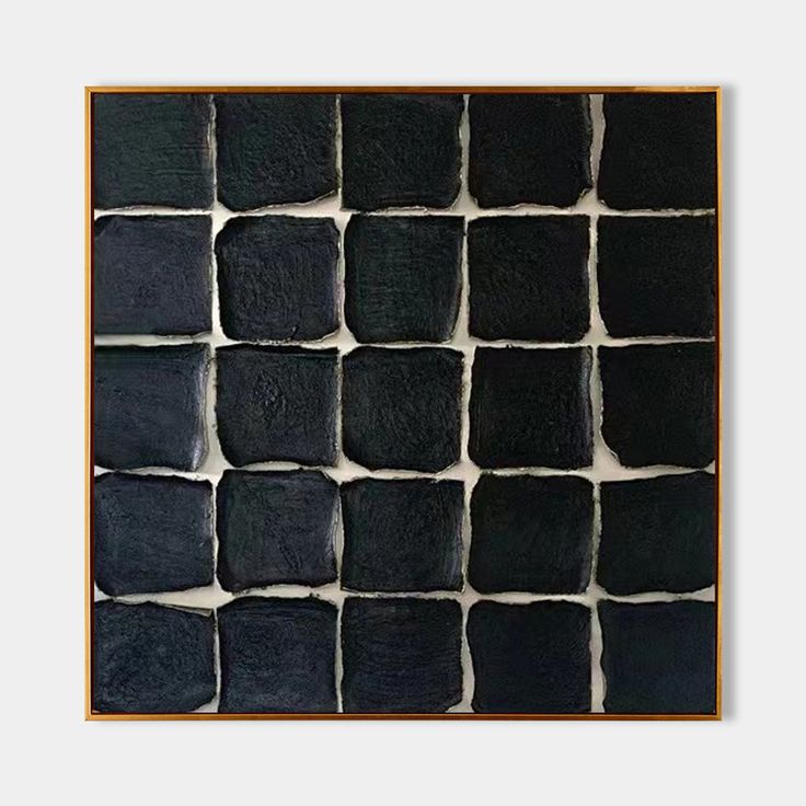 an abstract black and white painting with squares in the center, framed on a wooden frame