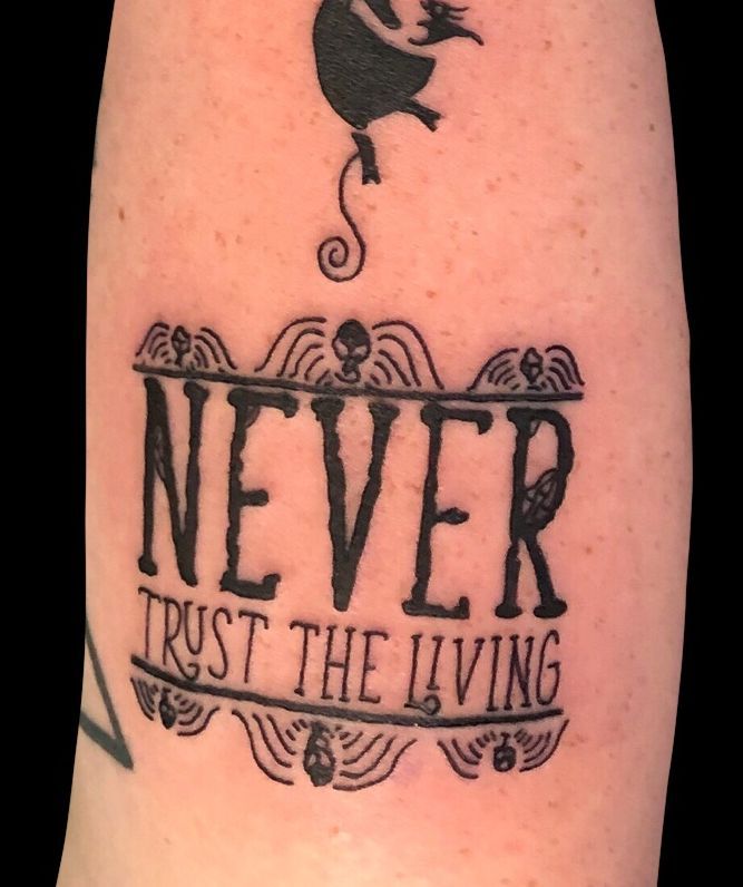 a tattoo that says never trust the living