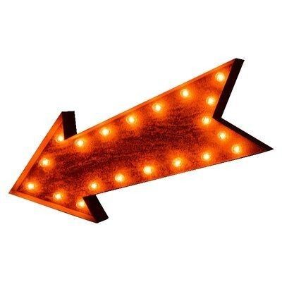 an arrow shaped light up sign with lights on it