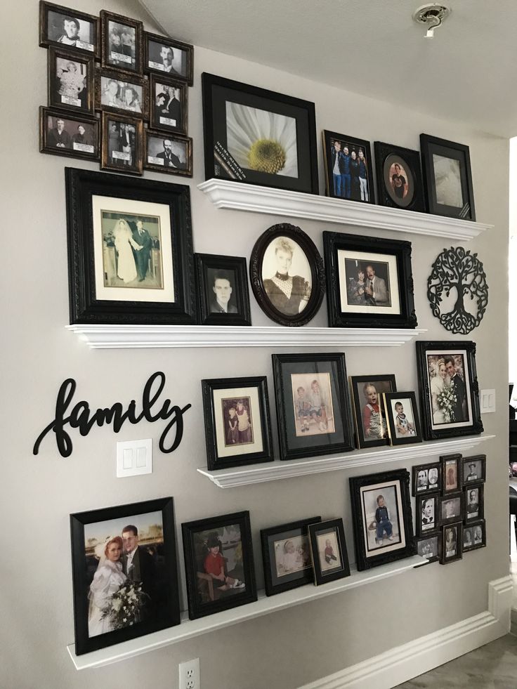 the family wall is filled with many different pictures and framed photos, including one for each family member