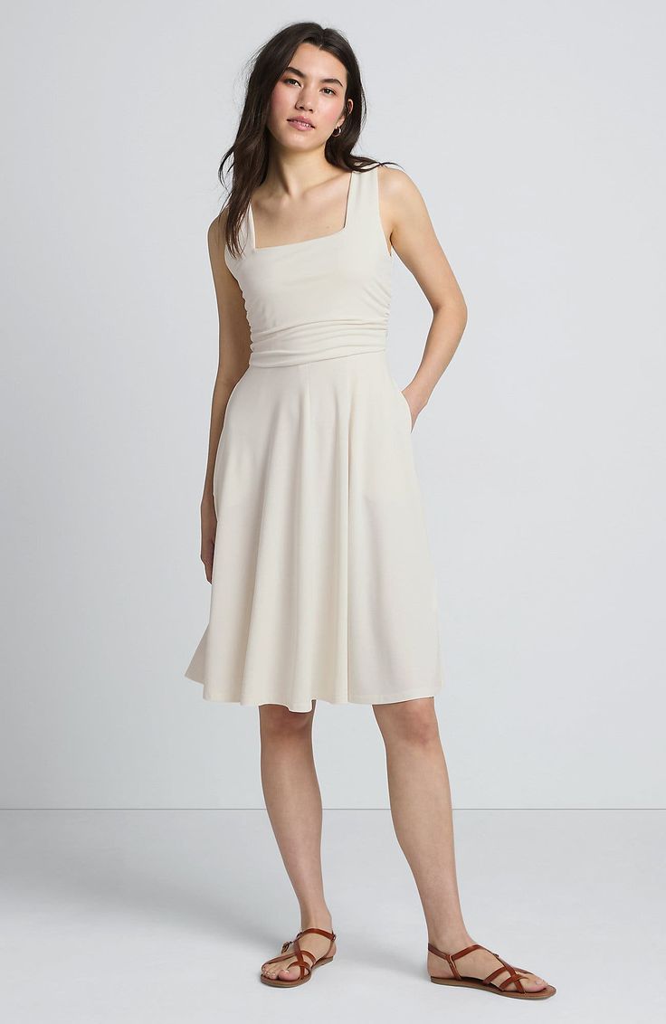 Cupro is a soft-to-the-touch fabric that feels almost like silk. It drapes beautifully, making it a perfect canvas for a dress. Not only that, it is naturally moisture-wicking, so it's perfect for the summer months. This dress has a built-in shelf bra for added support and the bodice is lined for more coverage. You can dress it up with heels and jewelry or dress it down with sandals and a sun hat! Buttery-soft, almost silky fabric drapes beautifully Sleeveless, fit-and-flare style with a square Beige Sleeveless Midi Dress With Ruched Bodice, Flowy Sleeveless Beige Midi Dress, Sleeveless Beige Midi Dress With Ruched Detail, Beige Flowy Sleeveless Midi Dress, Beige Sleeveless Ruched Midi Dress, Beige A-line Ruched Dress, Beige Ruched A-line Dress, Cream Sleeveless Ruched Midi Dress, Cream Sleeveless Midi Dress With Ruched Detail