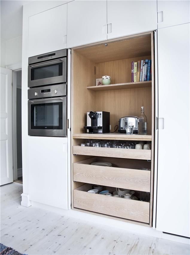 an open door to a kitchen with the words space saving doors above it and below it