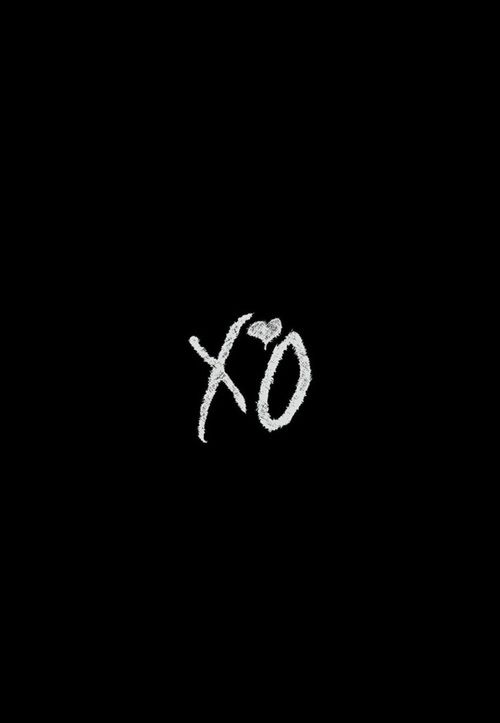 the word xo written in white chalk on a black background