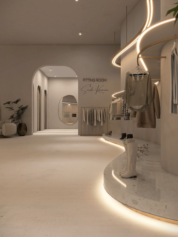 the inside of a clothing store with white walls