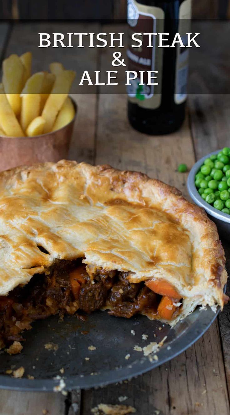 there is a pie with meat and vegetables in the pie pan on the table next to peas