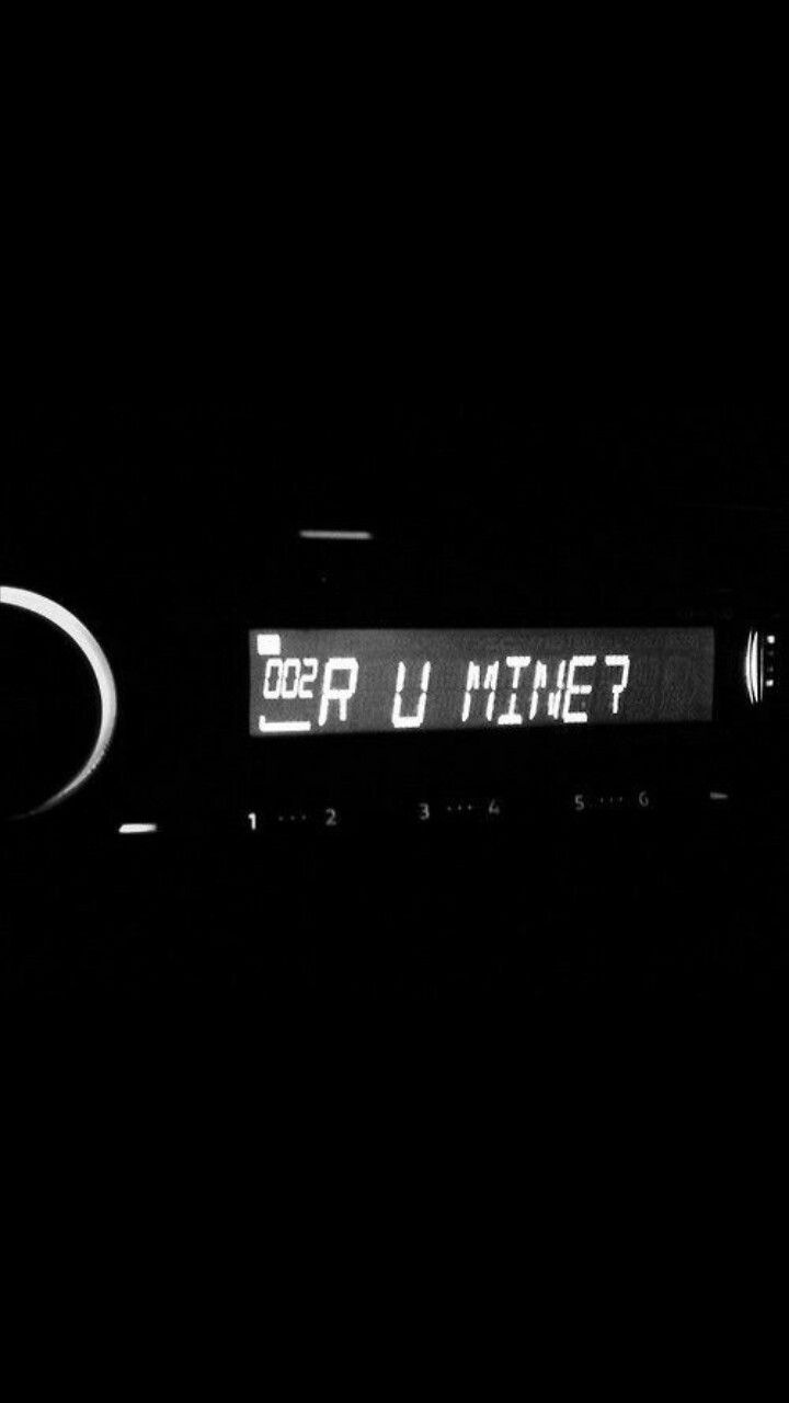 an electronic clock with the time on it's display in black and white photo