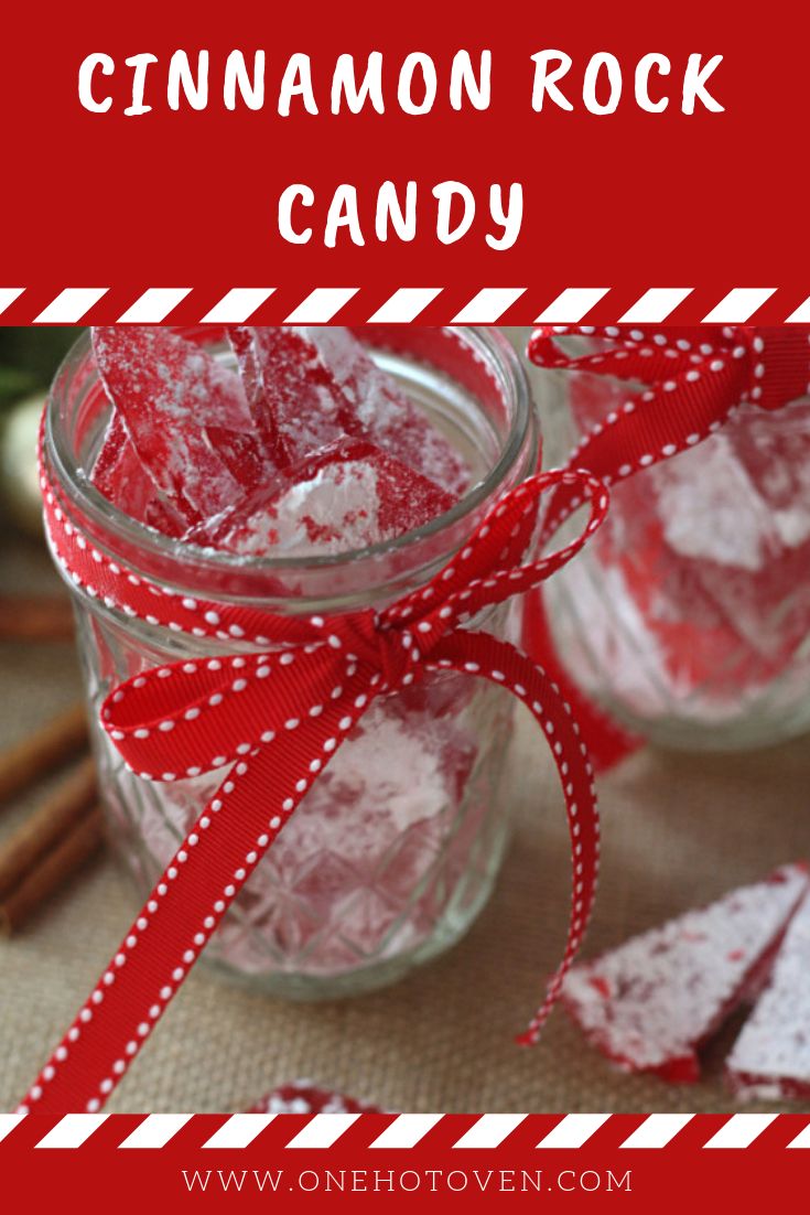 cinnamon rock candy in a glass jar with red ribbon