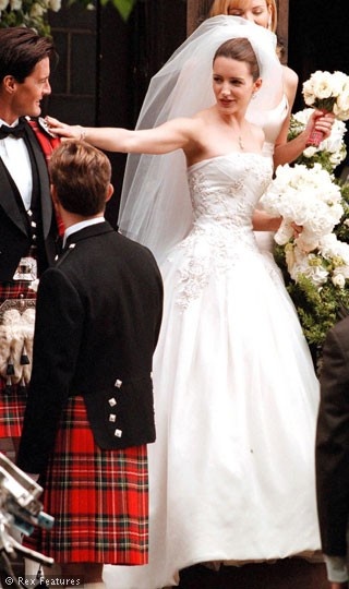 the bride and groom are getting ready to walk down the aisle