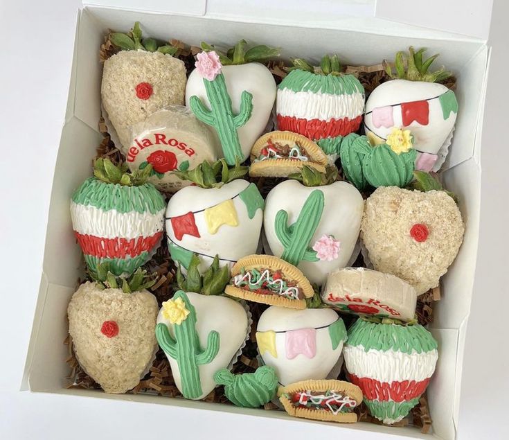 a box filled with assorted decorated cookies