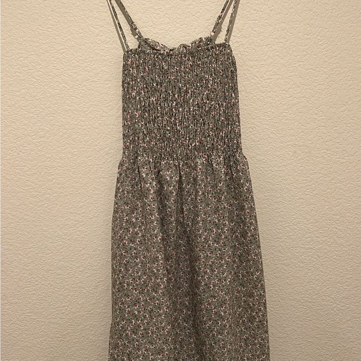 Adjustable Strap Dress With Open Back. Light Green With Floral Print. In Good Condition Never Worn With Tag On It Still. Stretchy Material. Casual Sundress With Ditsy Floral Print For Daywear, Casual Sleeveless Midi Dress With Ditsy Floral Print, Casual Patterned Sundress For Day Out, Casual Sleeveless Lined Floral Dress, Casual Sleeveless Floral Dress With Smocked Back, Patterned Casual Midi Dress For Day Out, Casual Patterned Midi Dress For Day Out, Casual Lined Floral Beach Dress, Casual Lined Floral Dress For Beach