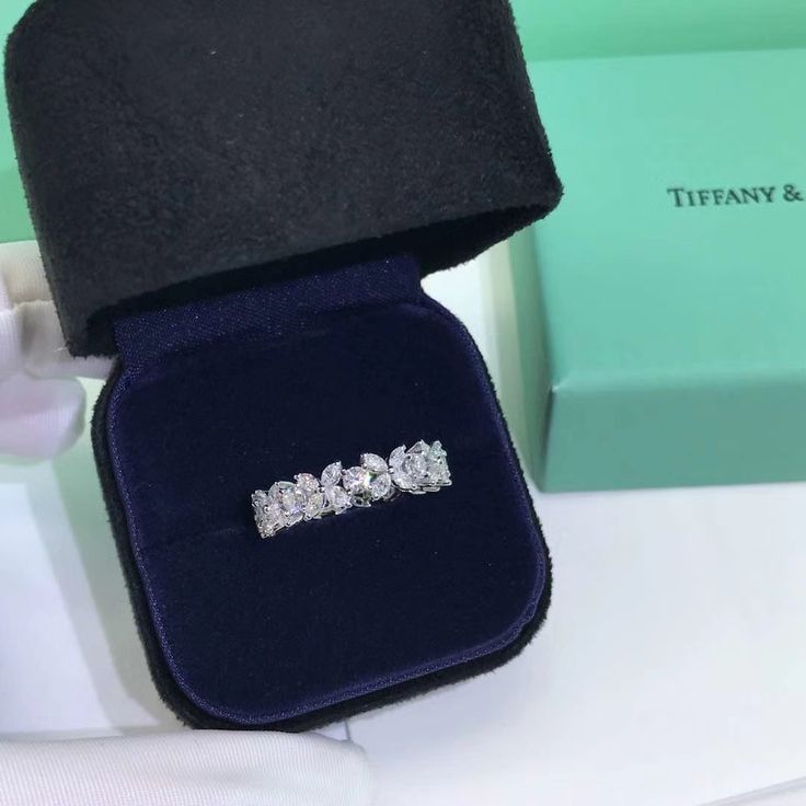 three stone diamond ring in velvet case on display at tiffany & co jewelery store