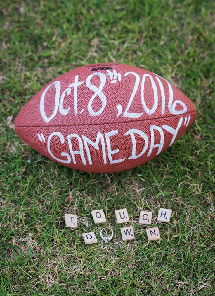 a game day football and scrabbles on the grass with words spelled out