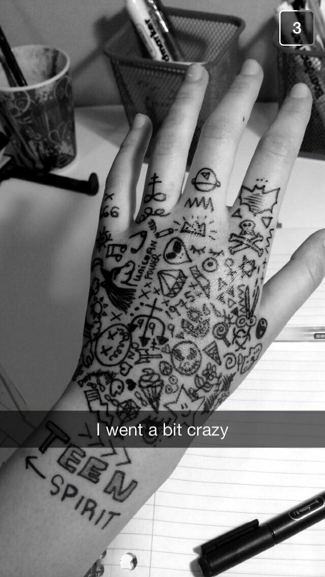 a person's hand with tattoos on it and the words i want a bit crazy