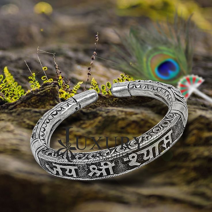 92.5% pure silver handmade excellent unisex bangle bracelet kada, amazing Divine lord Krishna "JAI SHRI SHYAMA" Mantra kada, best customized chitai work unisex personalized gift from India, Metal-925 sterling silver. Item type-Bangle bracelet. Weight-42.420 grams width-1.0 cm size-2-6 to 2-10 or (easily wear by twisting both faces of kada) stamped-925 Finish-oxidized. makes excellent gifting for birthdays, mother's day, wedding anniversaries, valentines day, Christmas day Silver Bracelet For Puja And Festivals, Spiritual Sterling Silver Bracelet With Intricate Design, Silver Bracelets For Navratri, Handmade Silver Bangle For Puja, Spiritual Silver Bracelets For Navratri, Engraved Bangle For Ceremonial Festivals, Silver Bracelet For Navratri Rituals, Silver Bracelets For Navratri Rituals, Silver Bangle Bracelets For Puja