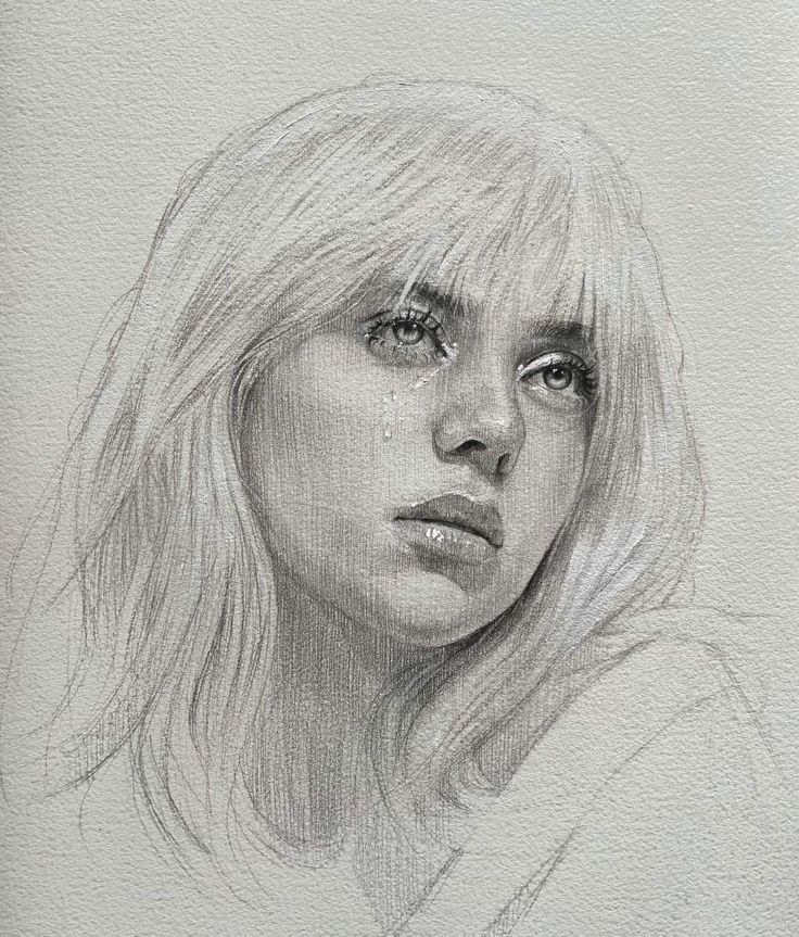 a pencil drawing of a woman's face with tears on her eyes and blonde hair