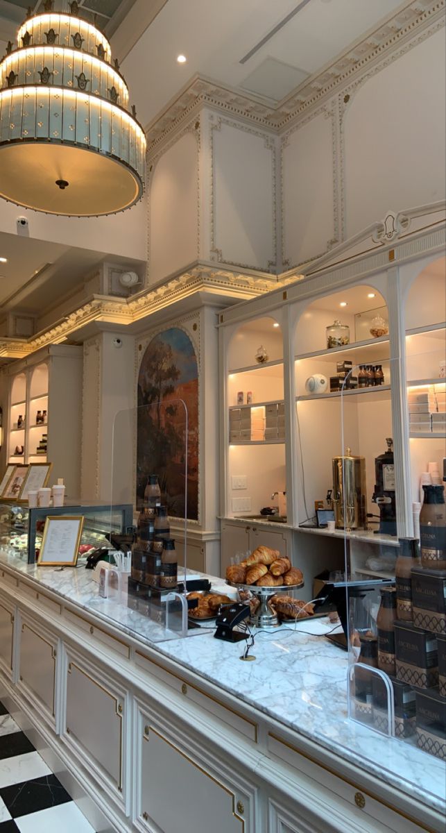 the interior of a bakery with lots of counter space